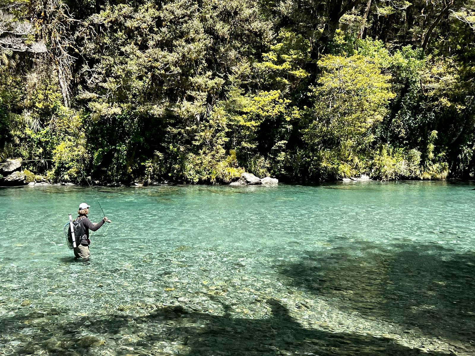 Guide and angler fly fishing a South Island river for the day