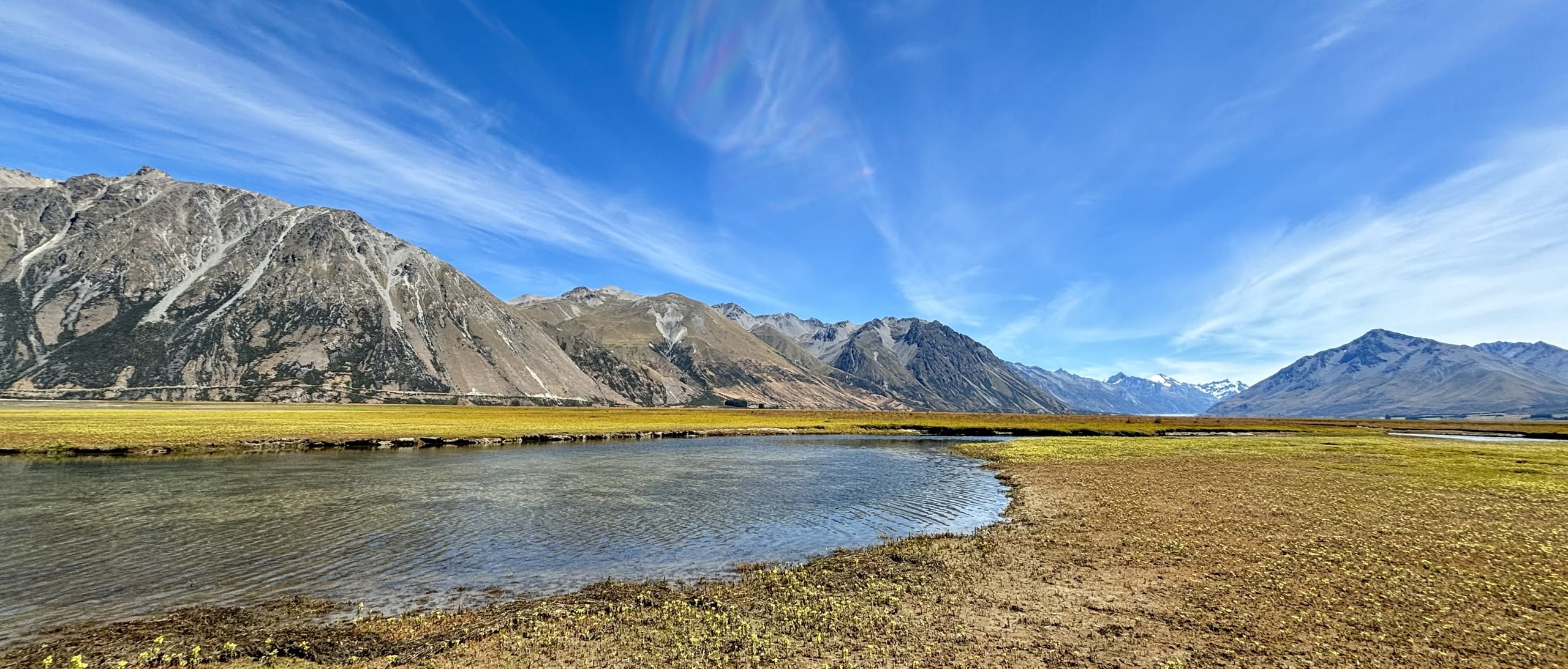 Angler fishing a crystal clear South Island river